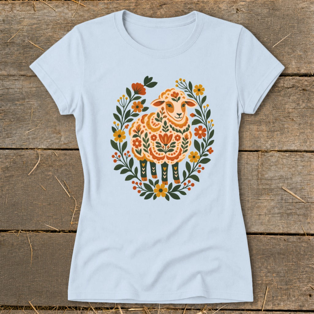 Light blue t-shirt with a decorative floral sheep design.
