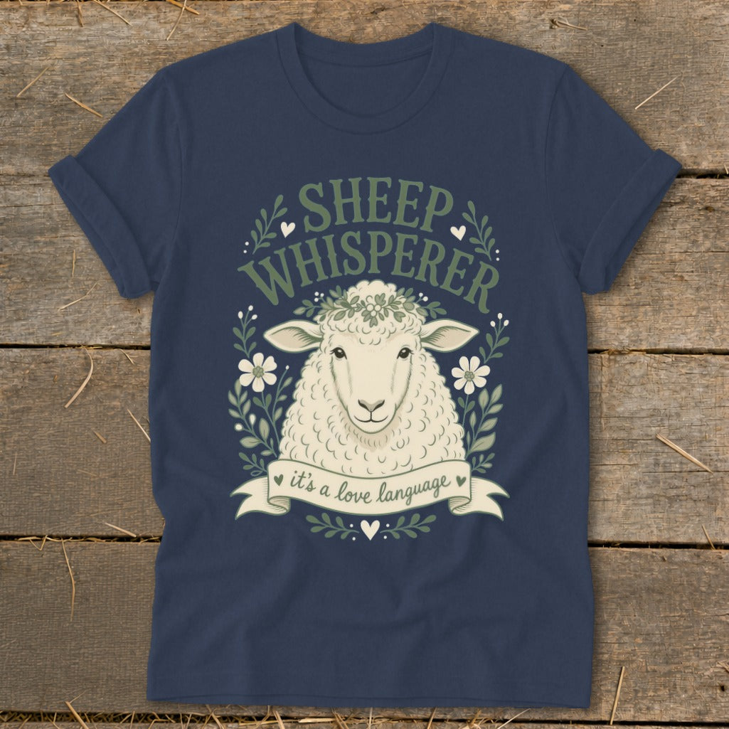 Navy t-shirt with a sheep wearing a flower crown and text "Sheep Whisperer" and "it's a love language".
