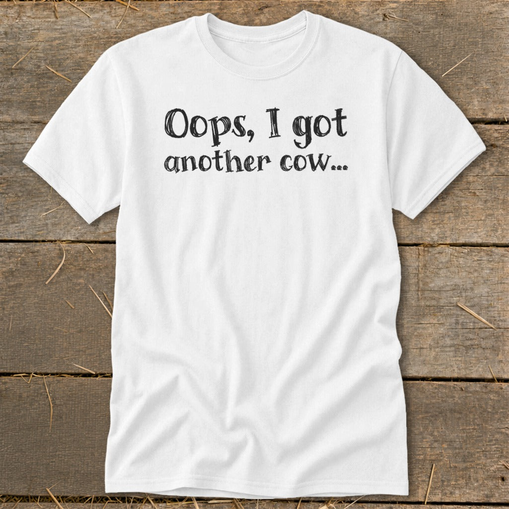 White t-shirt with black text reading "Oops, I got another cow..."