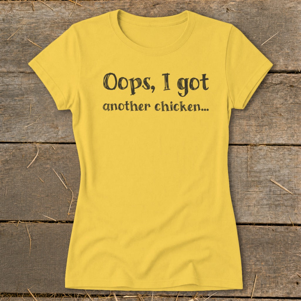 Yellow t-shirt with black text: "Oops, I got another chicken..."