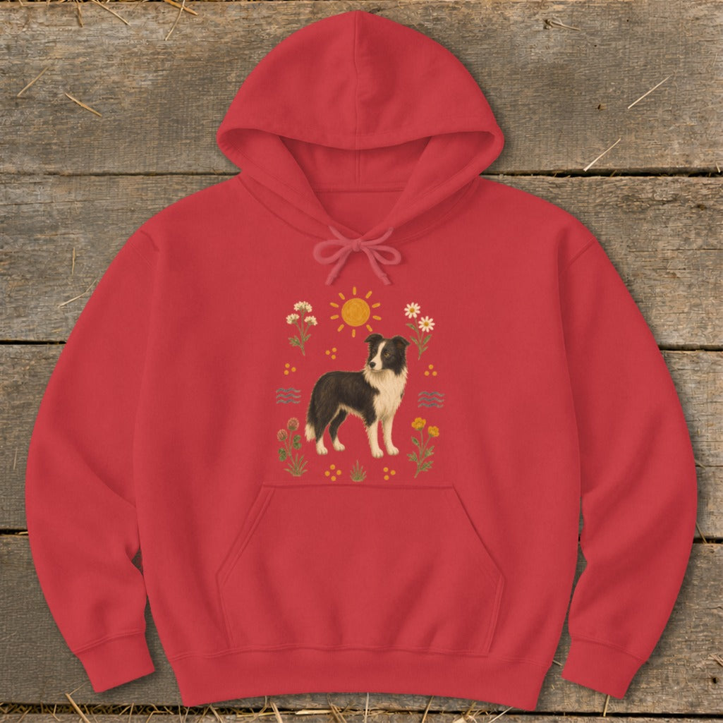 Red hoodie with a graphic of a border collie surrounded by flowers and the sun.