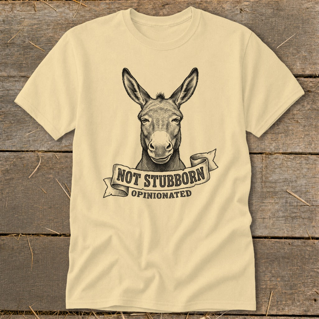 Light yellow t-shirt with a donkey graphic and text "NOT STUBBORN OPINIONATED".