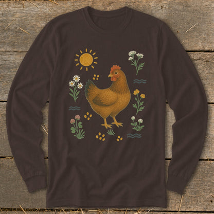 Brown long-sleeve shirt with a chicken illustration surrounded by flowers and sun.