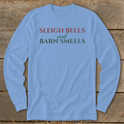 Light blue long sleeve shirt with red and green text that reads "Sleigh Bells and Barn Smells."