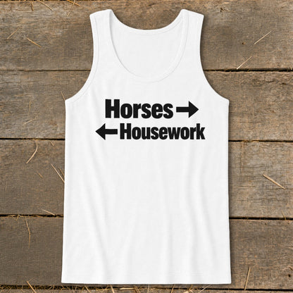 A white tank top featuring black text that reads Horses with a right arrow and Housework with a left arrow.