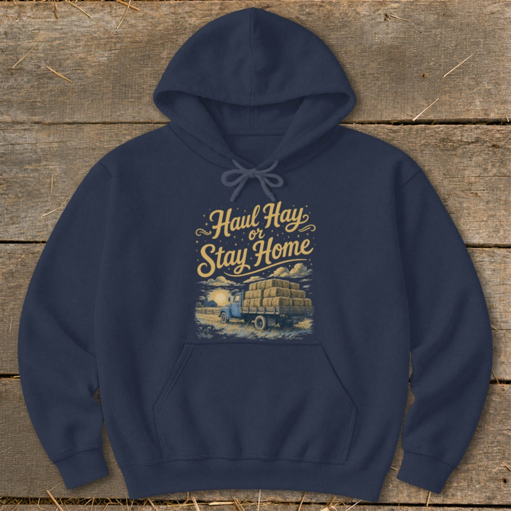 Navy hoodie with "Haul Hay or Stay Home" text and truck with hay bales graphic.