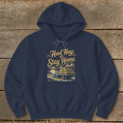 Navy hoodie with "Haul Hay or Stay Home" text and truck with hay bales graphic.