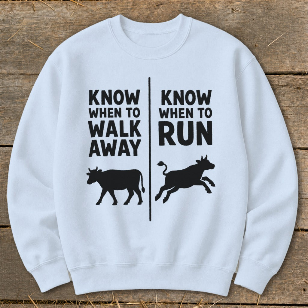 White sweatshirt with black text "Know When To Walk Away" and "Know When To Run".