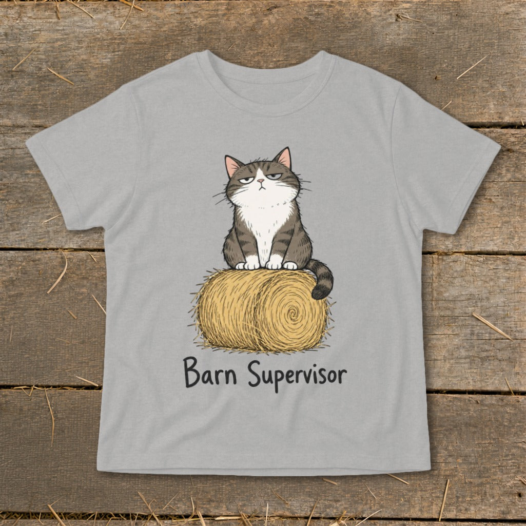 Grumpy cat sits on hay bale with text "Barn Supervisor" below.