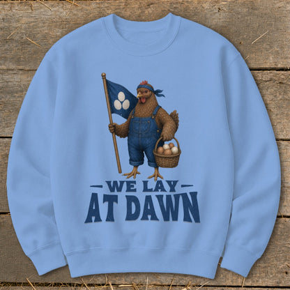 Light blue sweatshirt with chicken graphic and "We Lay At Dawn" text.