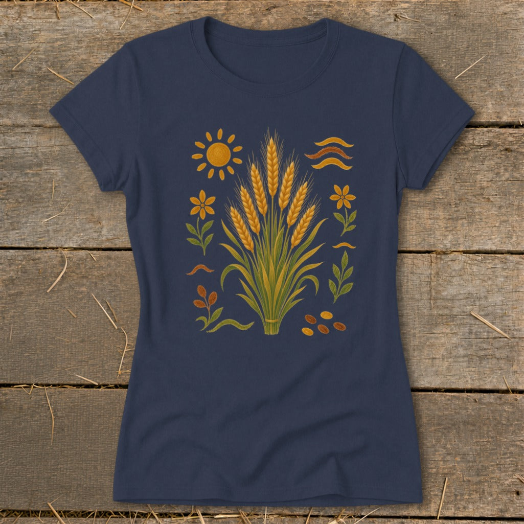 Navy t-shirt with a central illustration of wheat stalks, sun, flowers, and seeds.