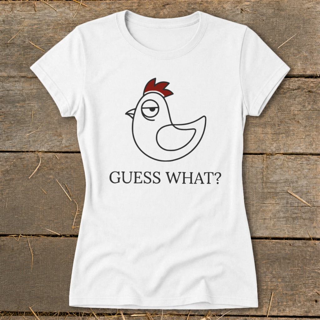 White t-shirt with a cartoon chicken graphic and the text "GUESS WHAT?".