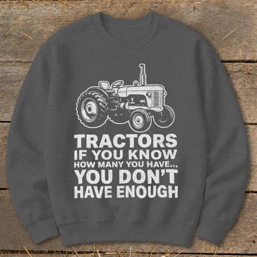 Gray sweatshirt with tractor graphic and text: "Tractors if you know how many you have... You don't have enough."