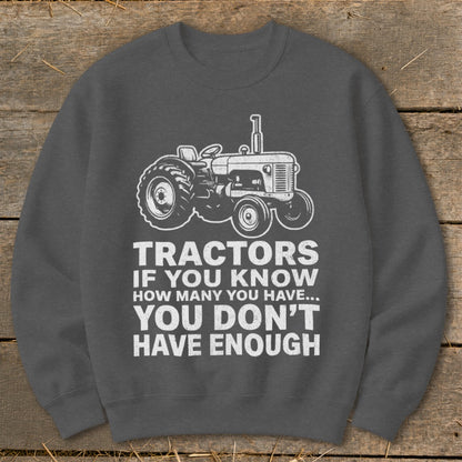 Gray sweatshirt with tractor graphic and text: "Tractors if you know how many you have... You don't have enough."