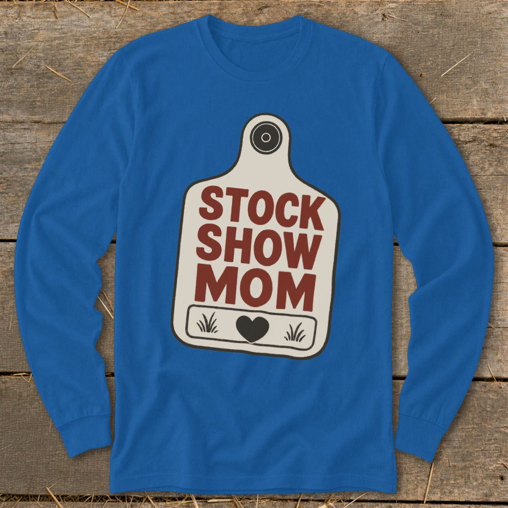Blue long-sleeve shirt with "STOCK SHOW MOM" graphic on a cow tag.