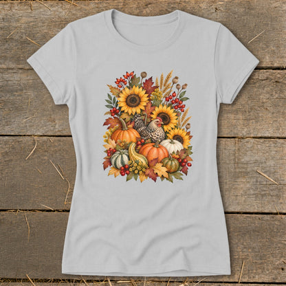 Light gray t-shirt with a watercolor fall harvest design featuring pumpkins, sunflowers, and chickens.