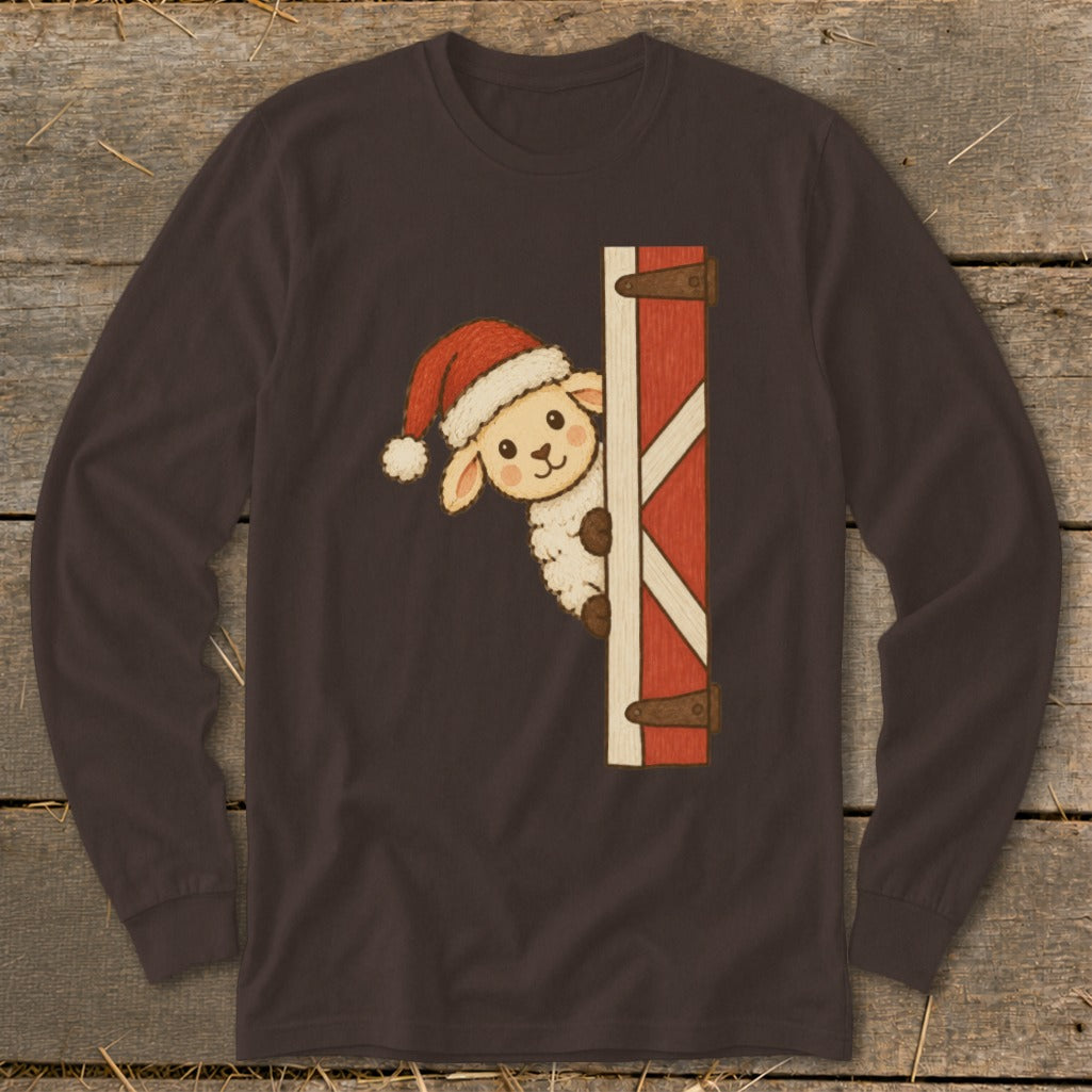 Sheep wearing a Santa hat peeks from behind a barn door.