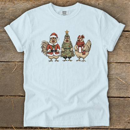 Light blue t-shirt with a Christmas-themed graphic of three chickens.