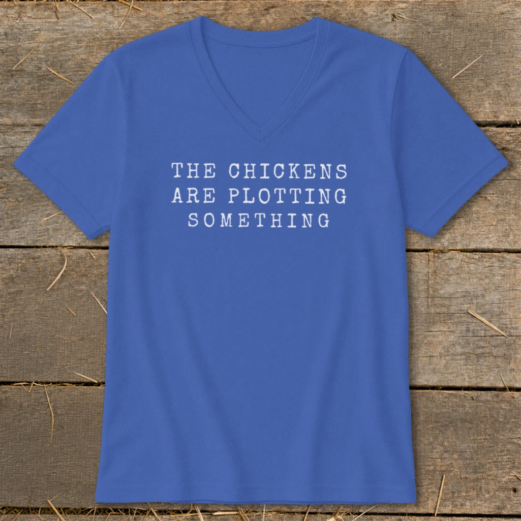 Royal blue v-neck t-shirt with white text "THE CHICKENS ARE PLOTTING SOMETHING."