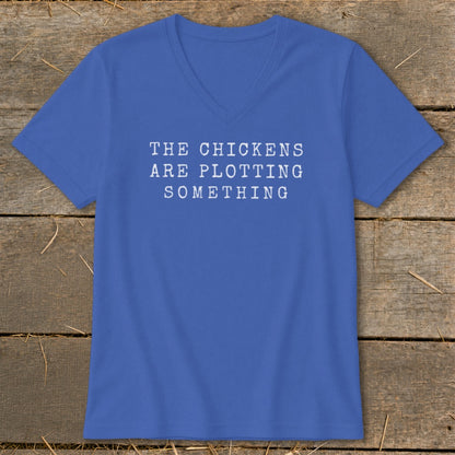 Royal blue v-neck t-shirt with white text "THE CHICKENS ARE PLOTTING SOMETHING."