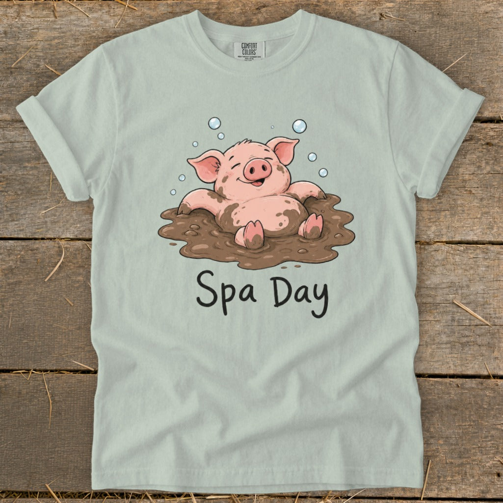 T-shirt with a cartoon pig in mud, bubbles, and text "Spa Day".
