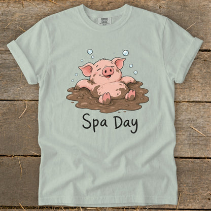 T-shirt with a cartoon pig in mud, bubbles, and text "Spa Day".