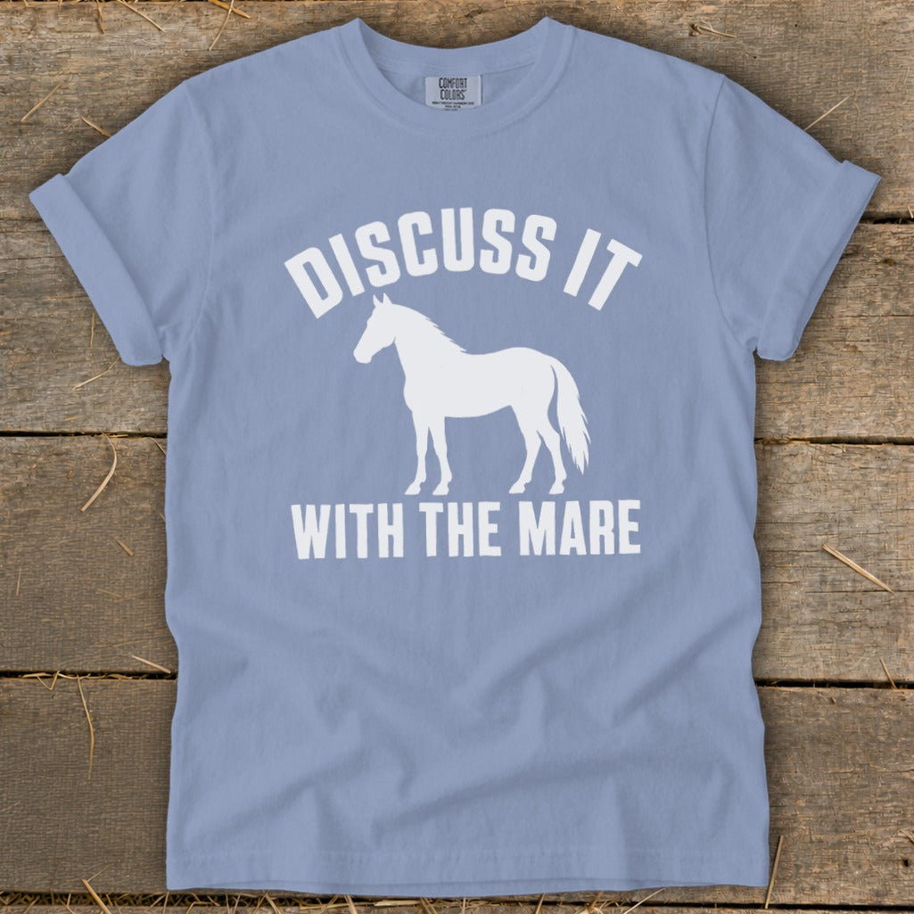 Light blue t-shirt with white text "DISCUSS IT" above a horse silhouette and "WITH THE MARE" below.