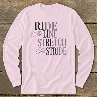 Pink long-sleeve shirt with text "RIDE The LINE STRETCH The STRIDE"