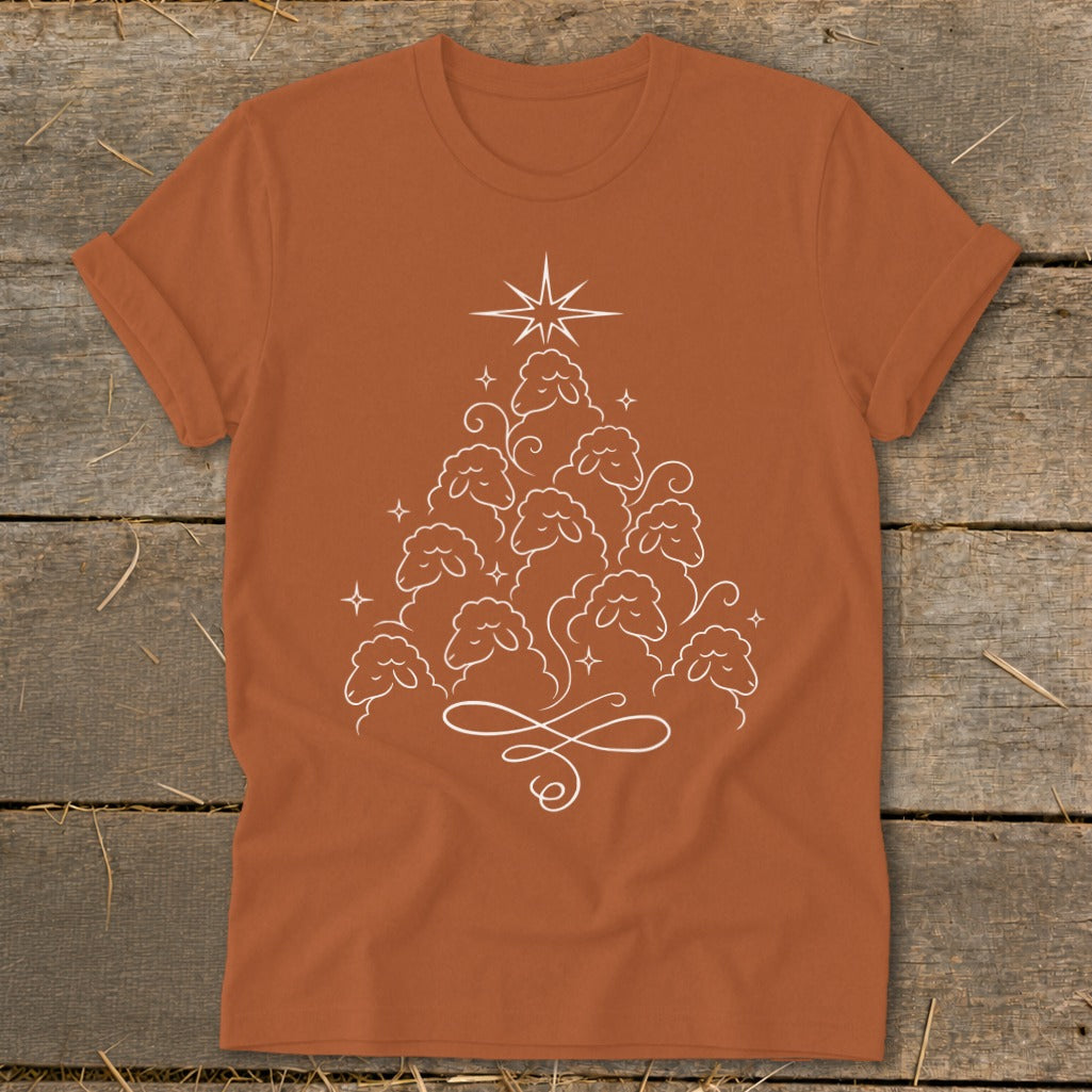 Orange t-shirt with a white line drawing of sheep forming a Christmas tree.