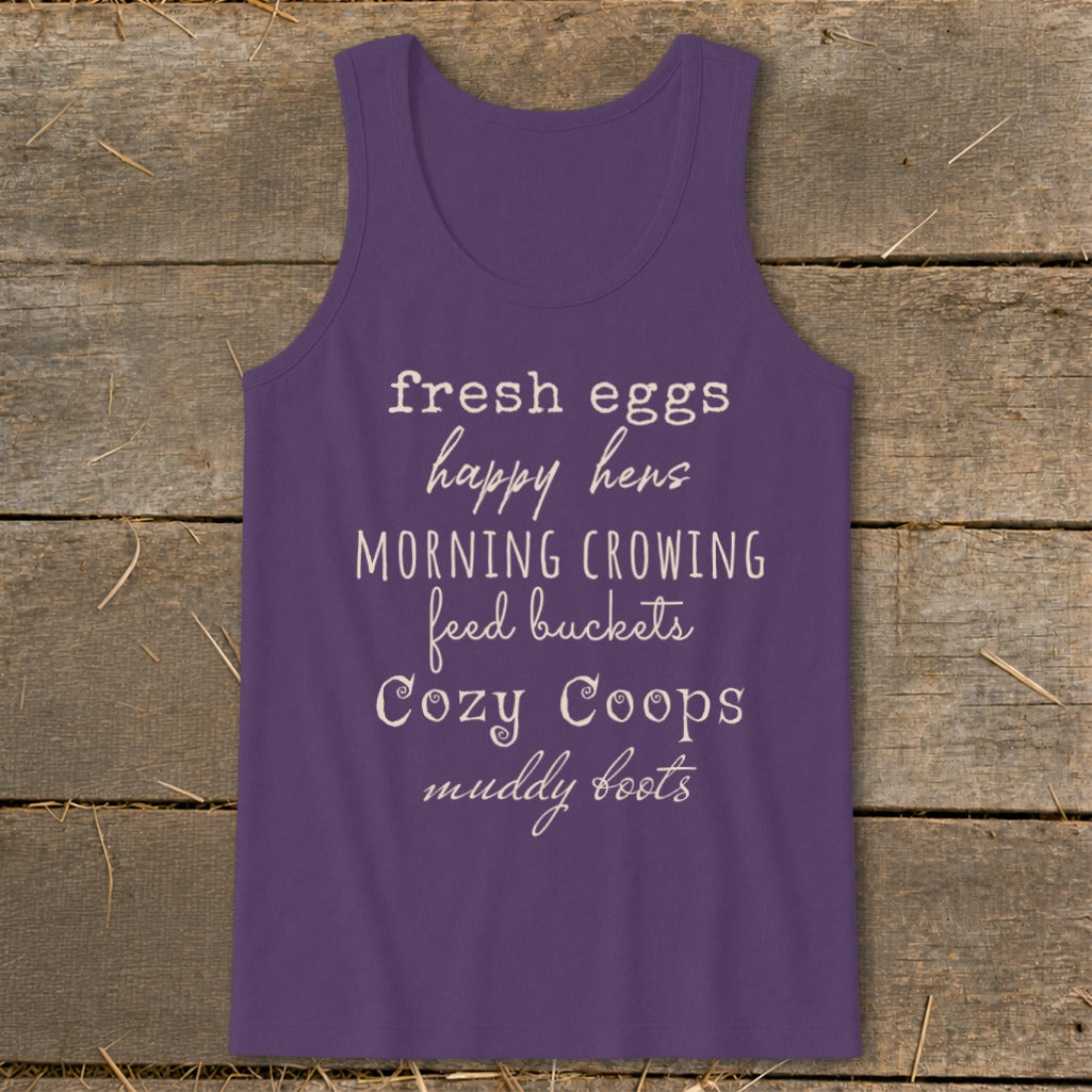 Purple tank top with "fresh eggs happy hens morning crowing feed buckets cozy coops muddy boots" text.