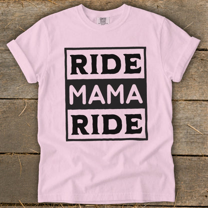 Pink t-shirt with black text boxes reading "RIDE MAMA RIDE".