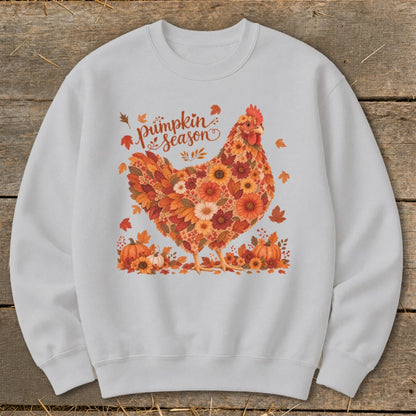 White sweatshirt with a chicken design made of autumn leaves and flowers, saying "Pumpkin Season."