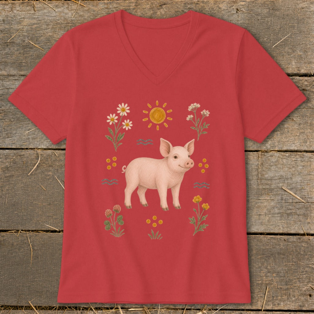 Red v-neck t-shirt with a watercolor-style illustration of a pig surrounded by flowers and sun.