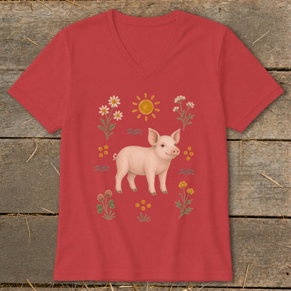 Red v-neck t-shirt with a watercolor-style illustration of a pig surrounded by flowers and sun.