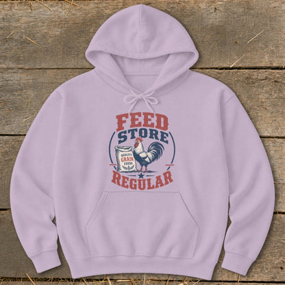 Light purple hoodie with "Feed Store Regular" graphic and rooster on a sack of grain.