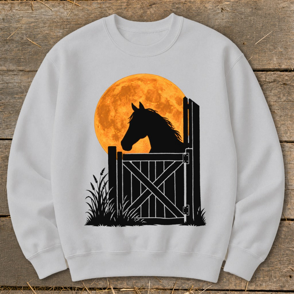 Light gray crewneck sweatshirt printed with a silhouette of a horse looking over a stable door against an orange moon.
