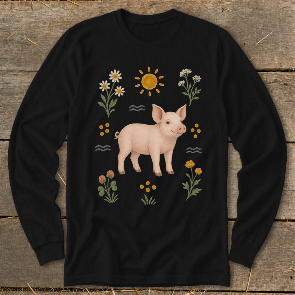 Black long-sleeve shirt with a pink pig, sun, and flowers illustration.
