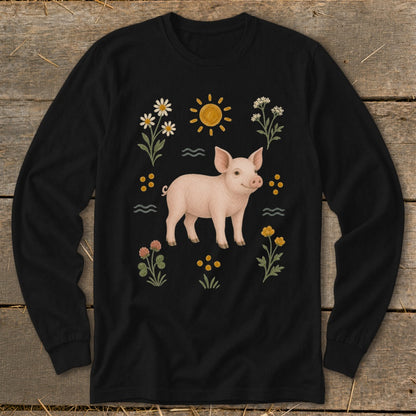 Black long-sleeve shirt with a pink pig, sun, and flowers illustration.