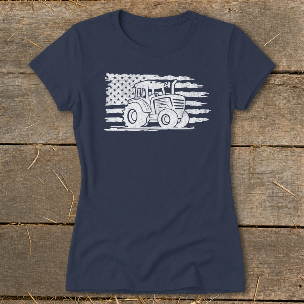 Navy t-shirt with a white distressed tractor graphic overlaid on an American flag.