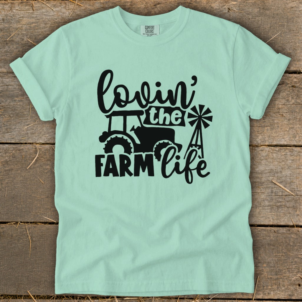 Light mint green t-shirt with black "Lovin' the Farm Life" graphic and tractor.