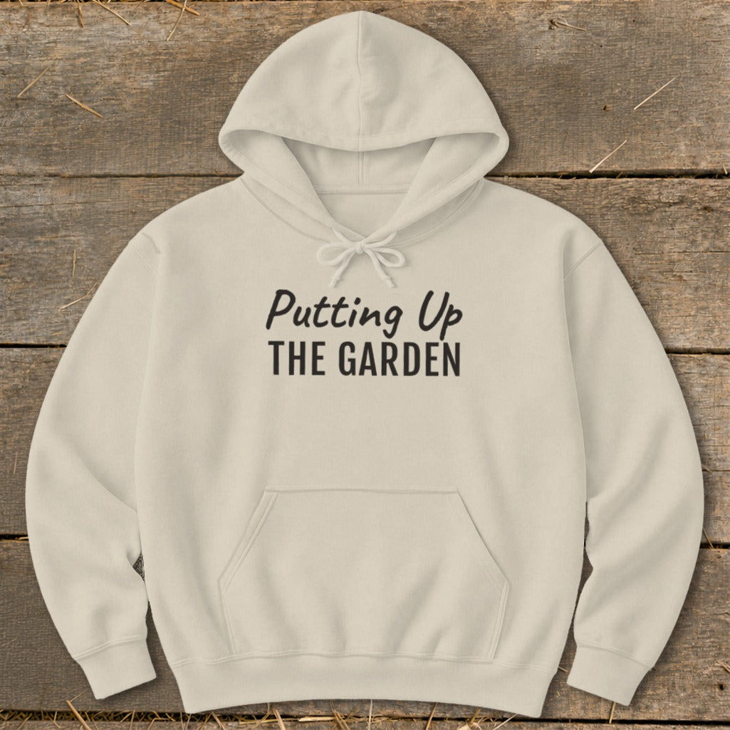 Cream hoodie with "Putting Up THE GARDEN" text on the front.