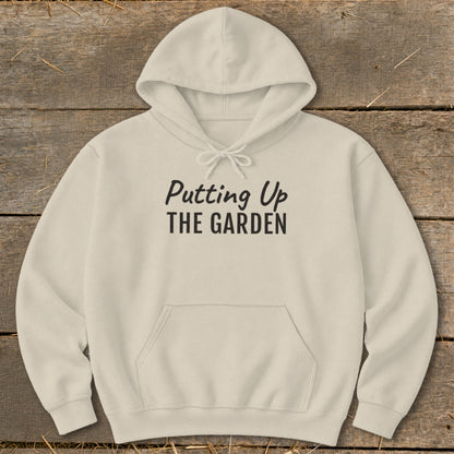 Cream hoodie with "Putting Up THE GARDEN" text on the front.