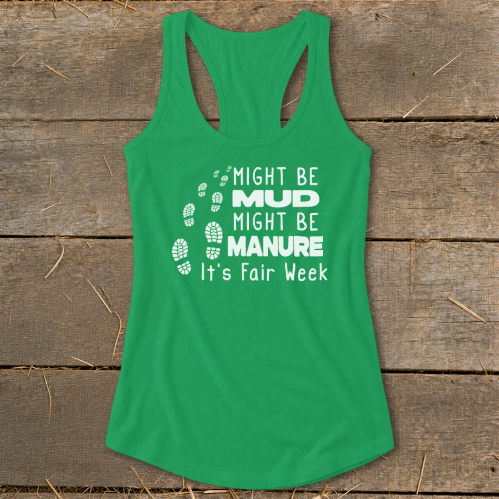 Green tank top with white text "MIGHT BE MUD, MIGHT BE MANURE, It's Fair Week" and footprints.