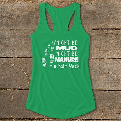 Green tank top with white text "MIGHT BE MUD, MIGHT BE MANURE, It's Fair Week" and footprints.