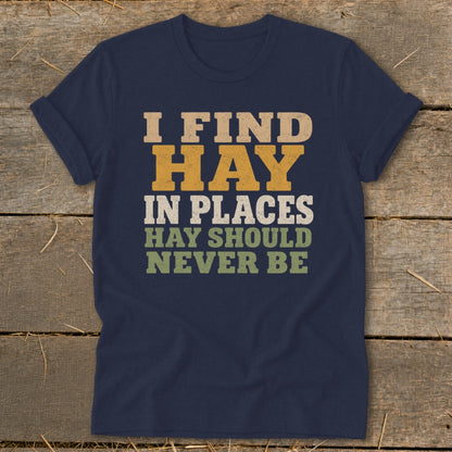 Navy t-shirt with text "I FIND HAY IN PLACES HAY SHOULD NEVER BE".