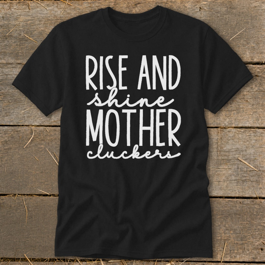 Black t-shirt with white text "RISE AND shine MOTHER cluckers".