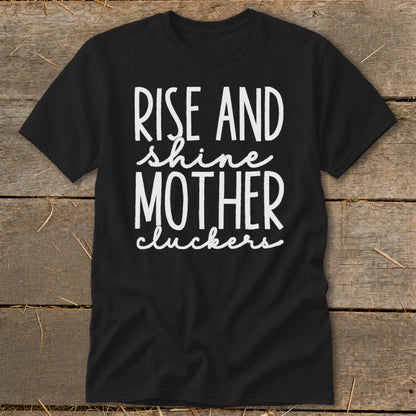 Black t-shirt with white text "RISE AND shine MOTHER cluckers".