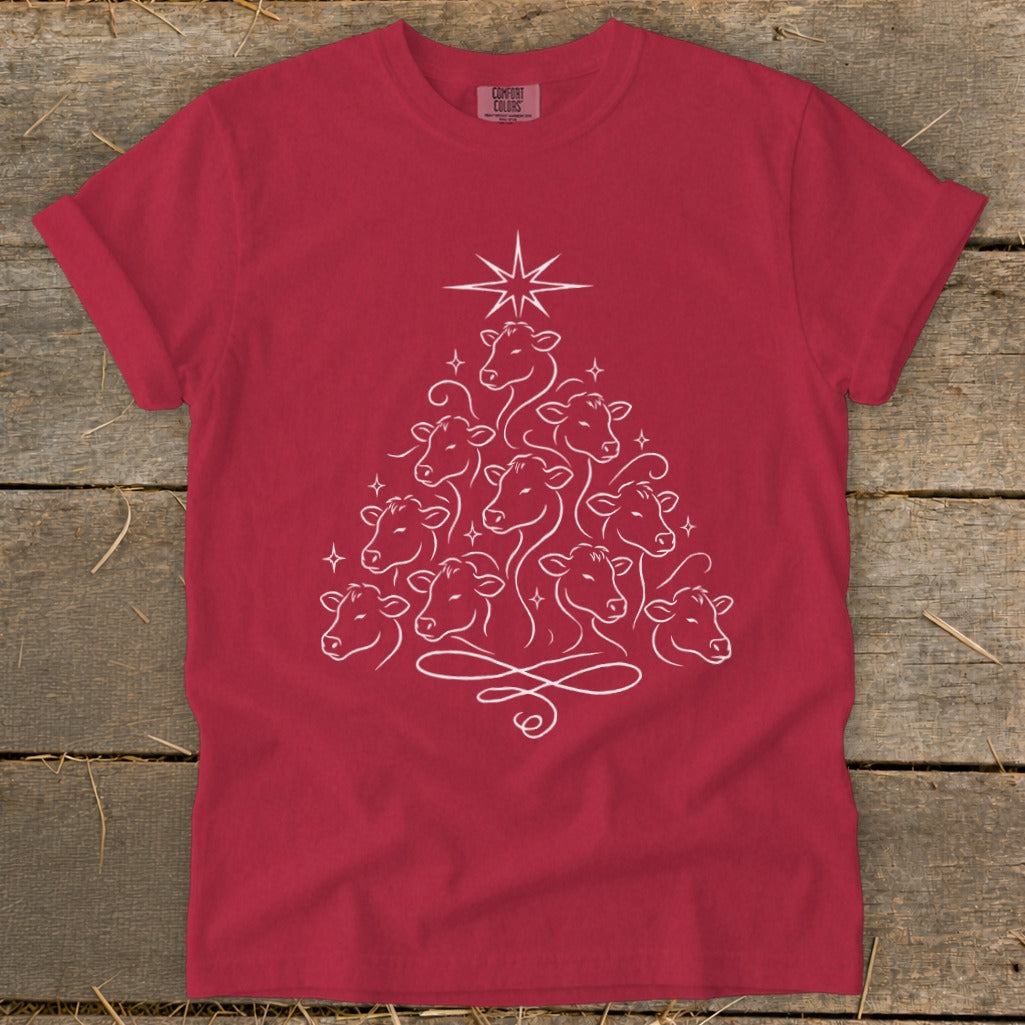 Red t-shirt with white line art of cows arranged in a Christmas tree shape.