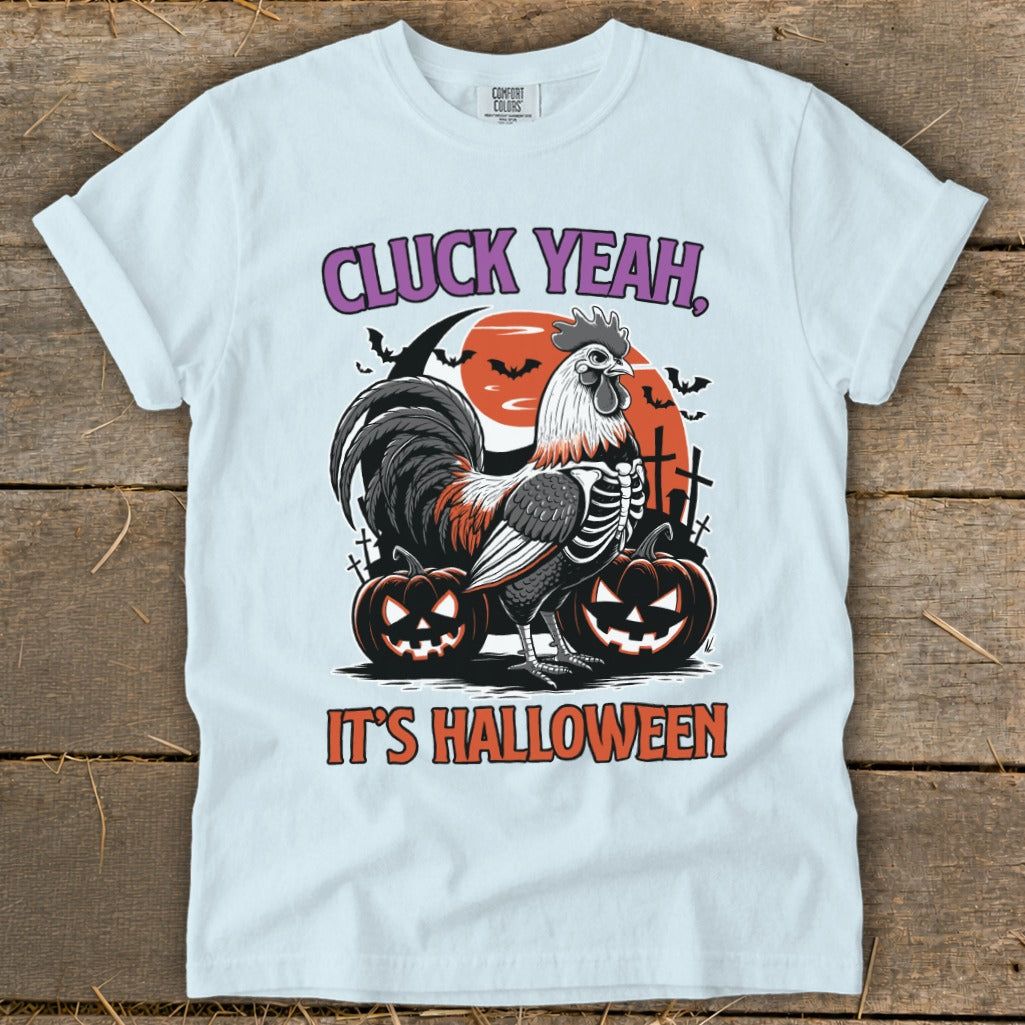 T-shirt with skeleton rooster, pumpkins, and bats, saying "CLUCK YEAH, IT'S HALLOWEEN."