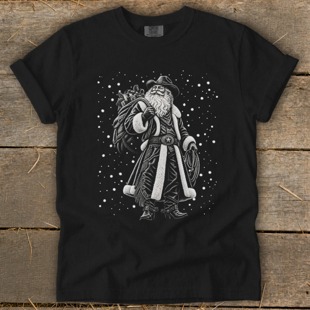 Black t-shirt with a cowboy Santa Claus graphic and falling snow.